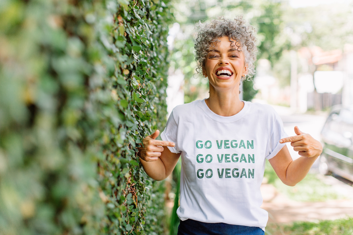 Woman advocating veganism outdoors